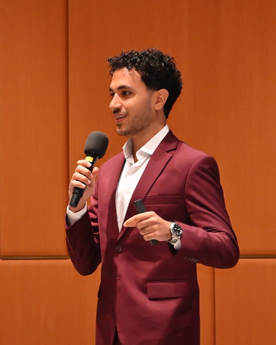 Mudi Elsaid, founder of Tasken, speaking on stage